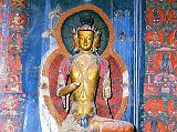 Tibet Guge 06 Tsaparang White Temple 08 04 Vairocana 1 There are six statues of a three-headed Vairocana, three on the left, three on the right, which together form a meditation cycle of Vairocana. Originally they were each enclosed in a richly decorated stucco frame (torana), an arch, usually depicting foliage and animate designs above the divinity's head. Small holes in the wall secured them around the images. Notice especially the thin, elongated torsos, the elongated faces, distinctive stomach cleavage, slight abdominal bulge, and extremely slender waists are all characteristic of Kashmiri art. Photo of second Vairocana - Weyer/Aschoff: Tsaparang, Tibets Grosses Geheimnis.